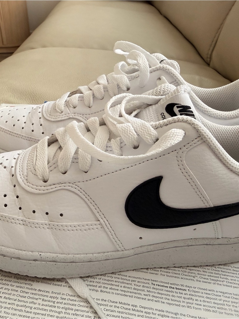 Nike White Low-Top Sneakers with Black Swoosh